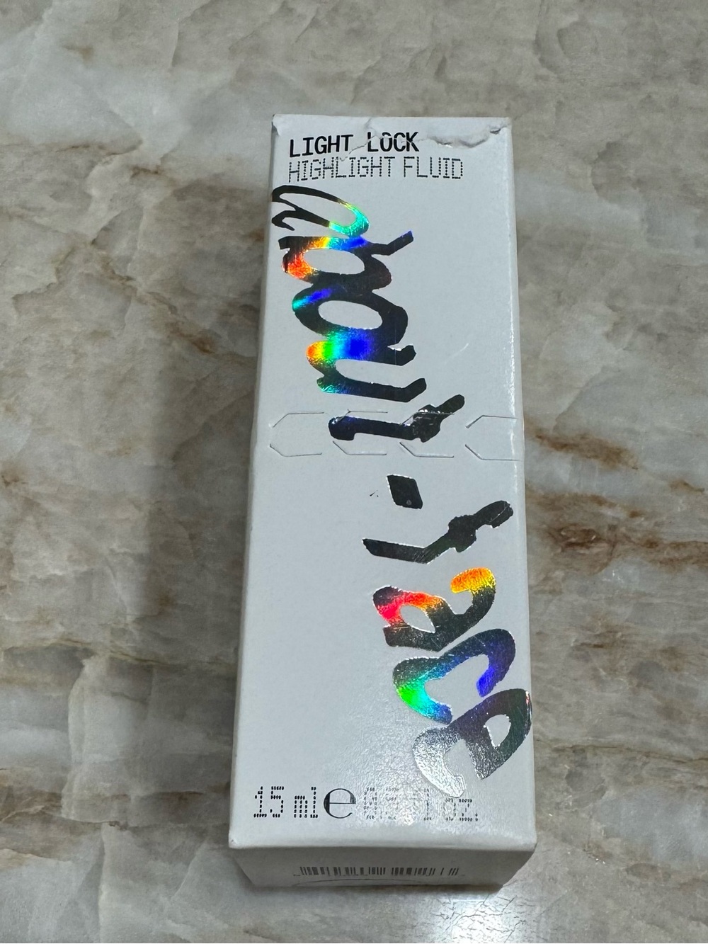 About Face Light Lock Highlight Fluid
